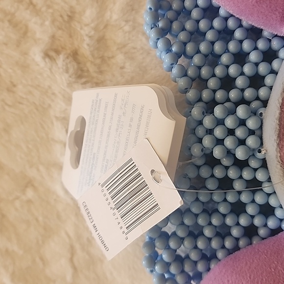 Lavender and blue Minnie Mouse ear with beadeddetails